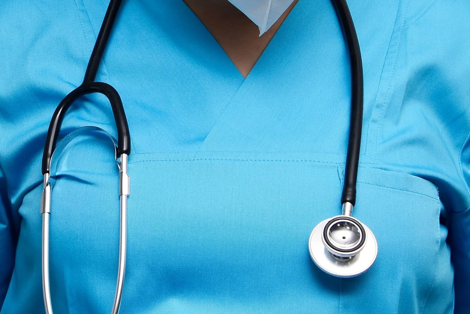 Nurse in blue scrubs with a stethoscope