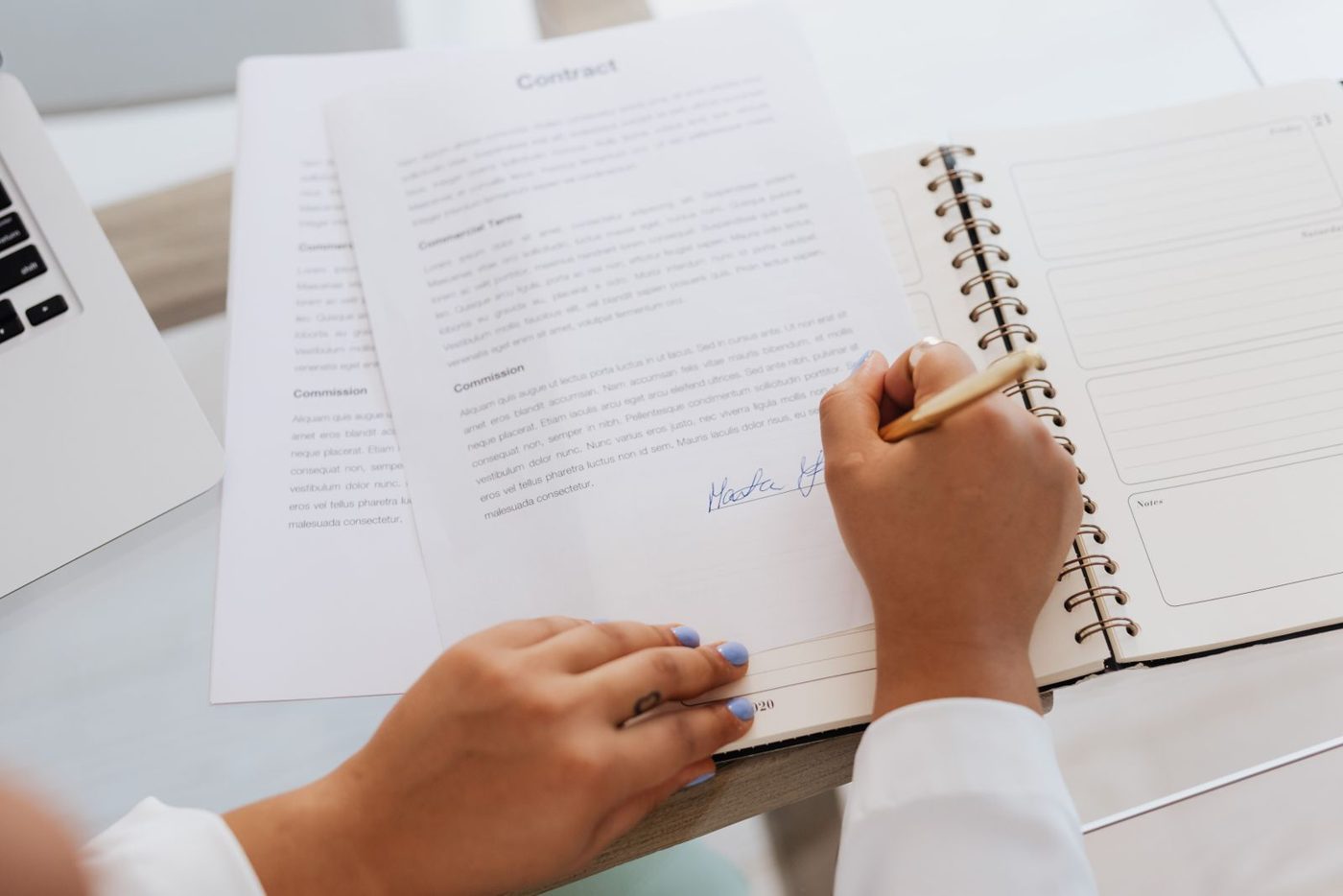 Loan paperwork and a pen on a desk