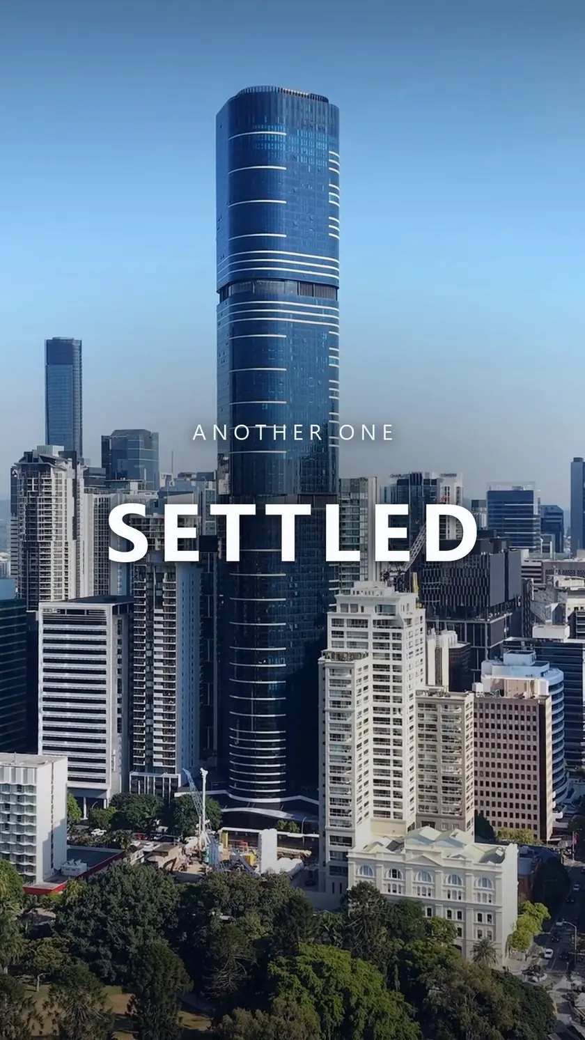 Aerial view of the Brisbane CBD skyline on a clear day, captioned: another one settled