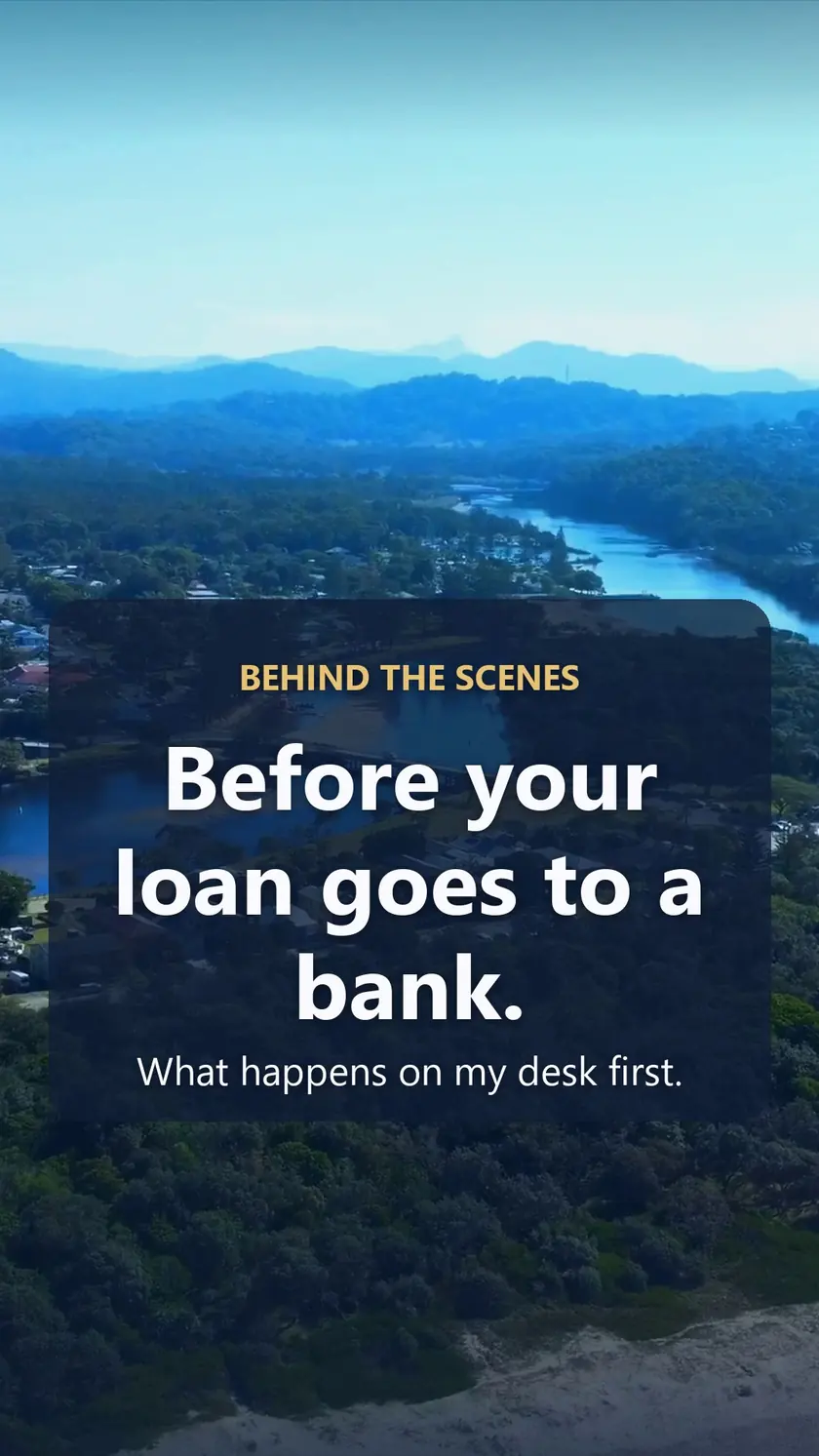 Aerial view of a river winding through a coastal town with the words Behind the scenes, before your loan goes to a bank.